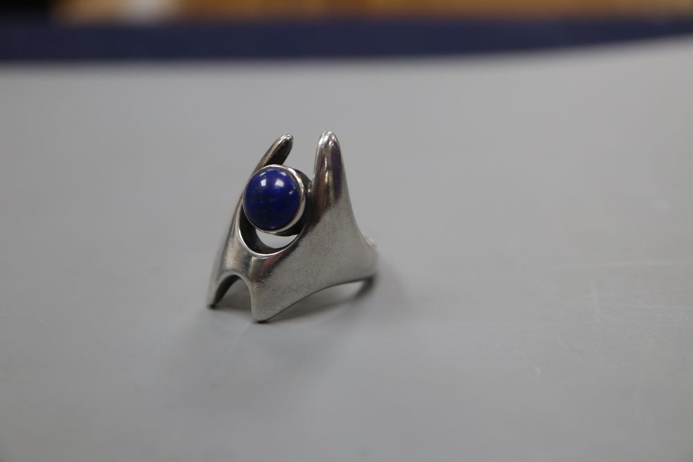A post 1945 Georg Jensen sterling and cabochon lapis lazuli dress ring, design no. 139, size O, gross 9 grams.